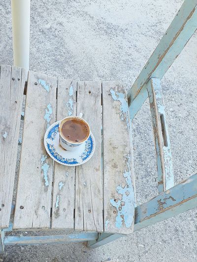 High angle view of coffee cup on table