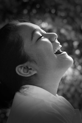 Close-up portrait of indonesian teenager girl laughing