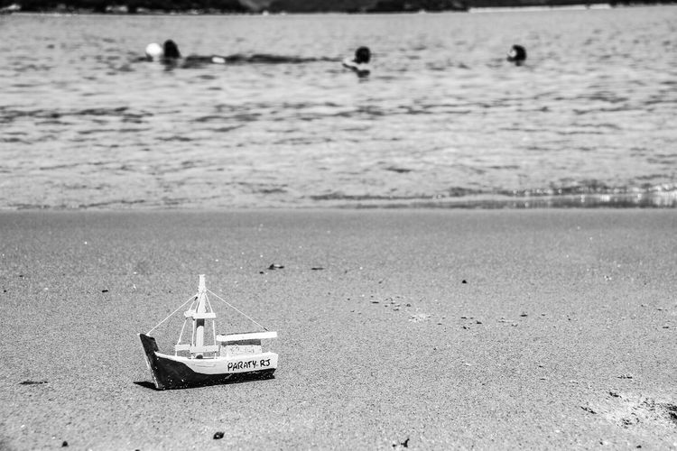 Boat ship beach sail black and white bw
