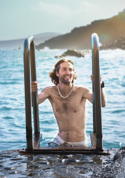 Portrait of young man in sea