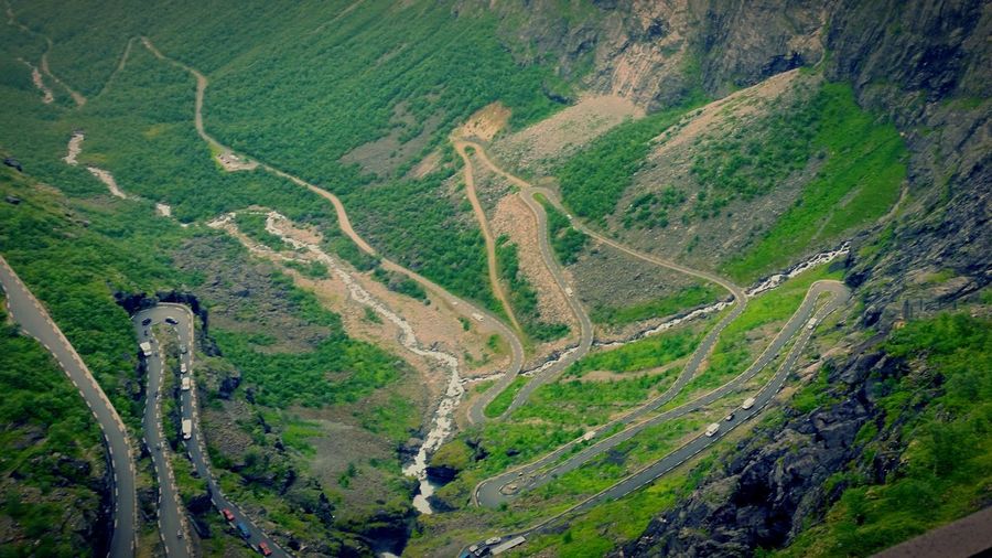 Aerial view of cars moving on road at mountains