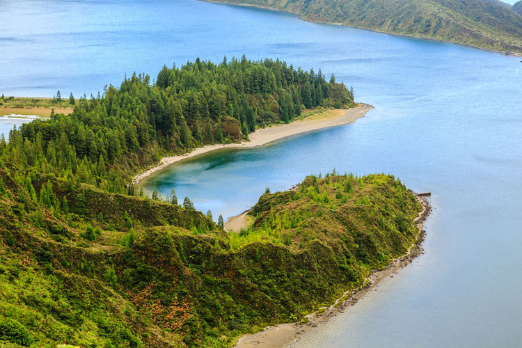 High angle view of trees and lake against sky