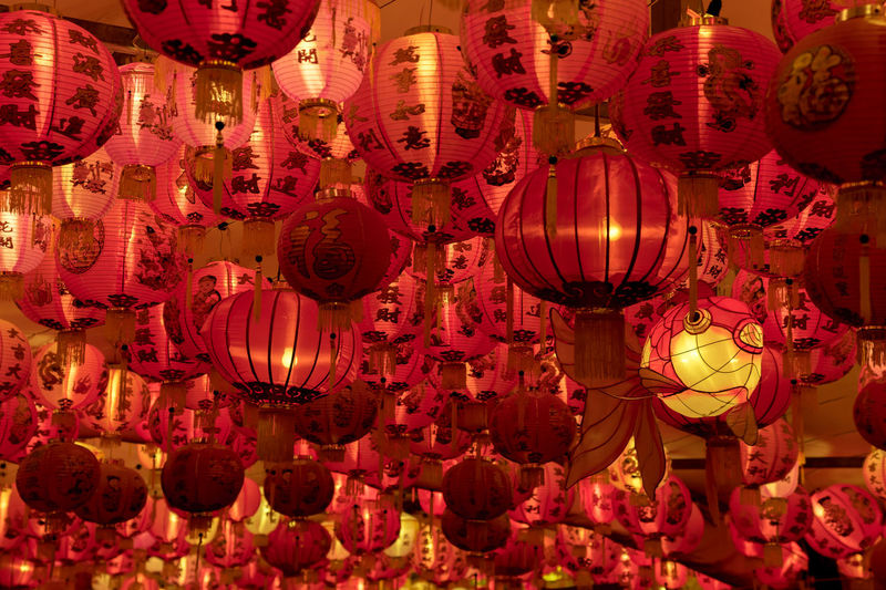 Low angle view of illuminated lanterns hanging in shop