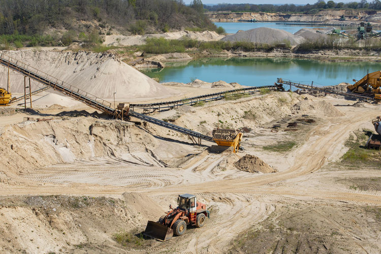 Gravel quarrying in a gravel pit during a drone flight