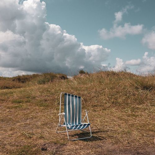 Chair left on the beach when day is over 