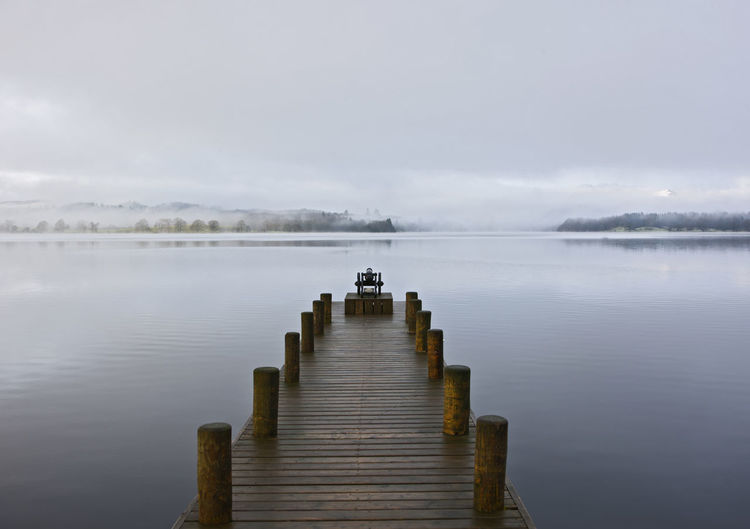 Pier at still lake in the british lake district