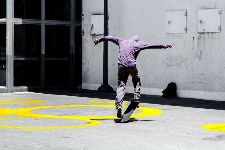 Full length of man skateboarding