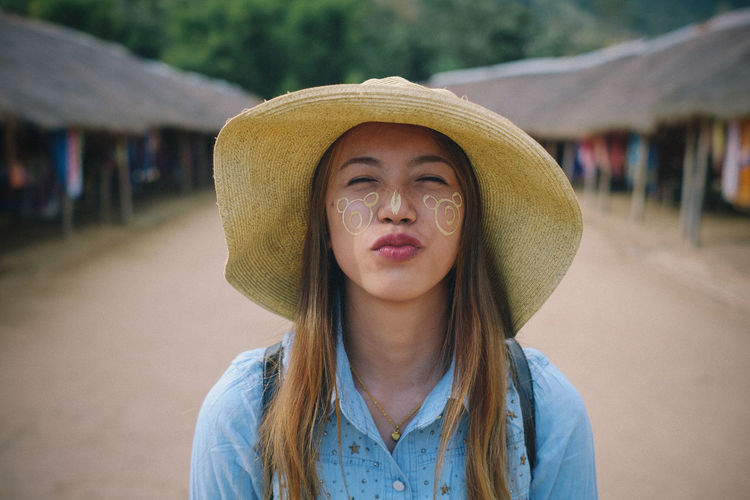 Portrait of woman wearing hat
