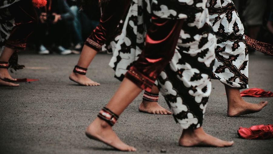 Low section of woman wearing traditional clothing during festival