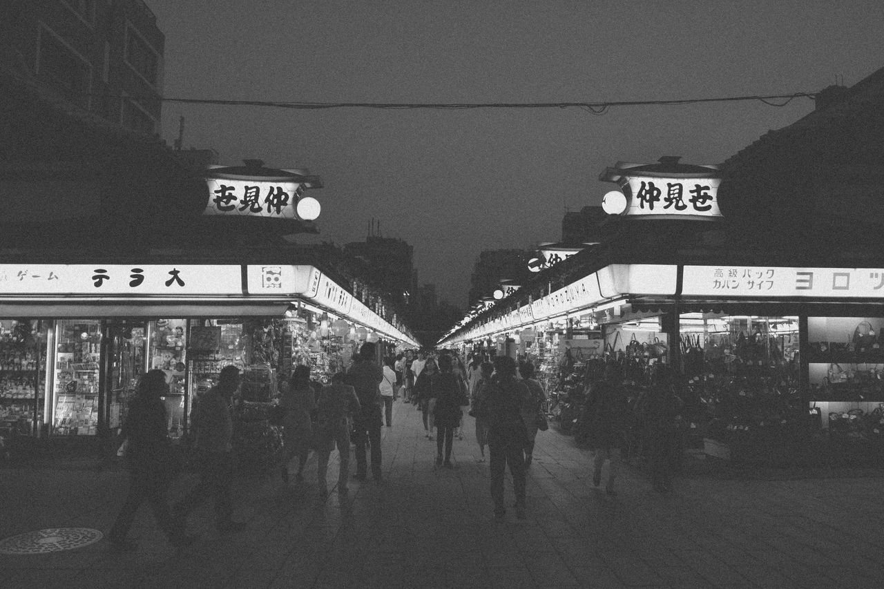 Crowded outdoor market at night