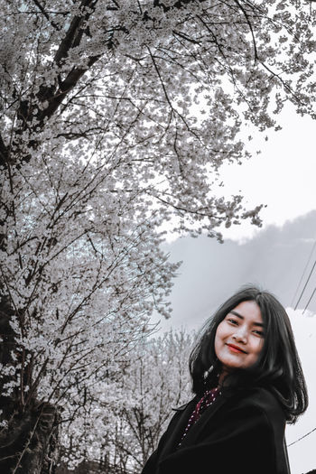 Portrait of a smiling young woman in winter