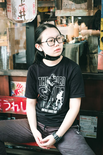 Portrait of young woman sitting in cafe