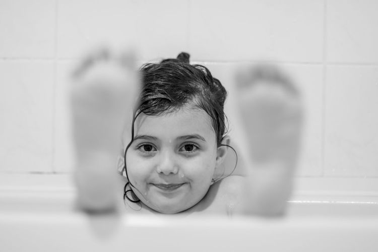 Portrait of smiling boy in bathroom