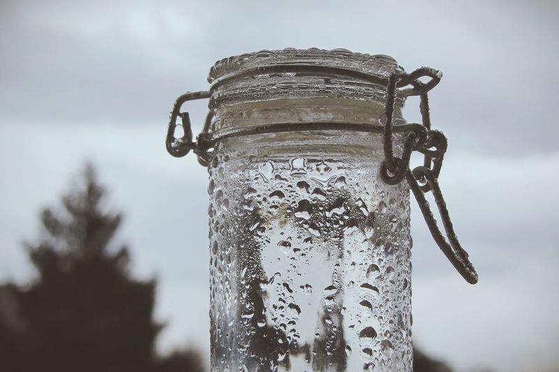 Close-up low angle view of water drops on glass