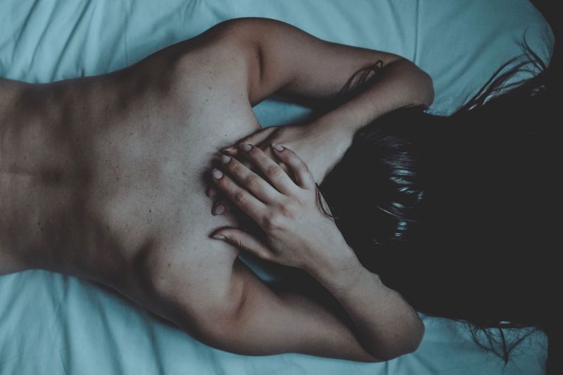Indoors Real People Young Women Young Adult Bed Touching Hand Women Human Hand Close-up Adult Woman Atmospheric Mood Atmosphere Hair Relaxation Fujifilm FujiX100T Shadows & Lights Light And Shadow Natural Light
