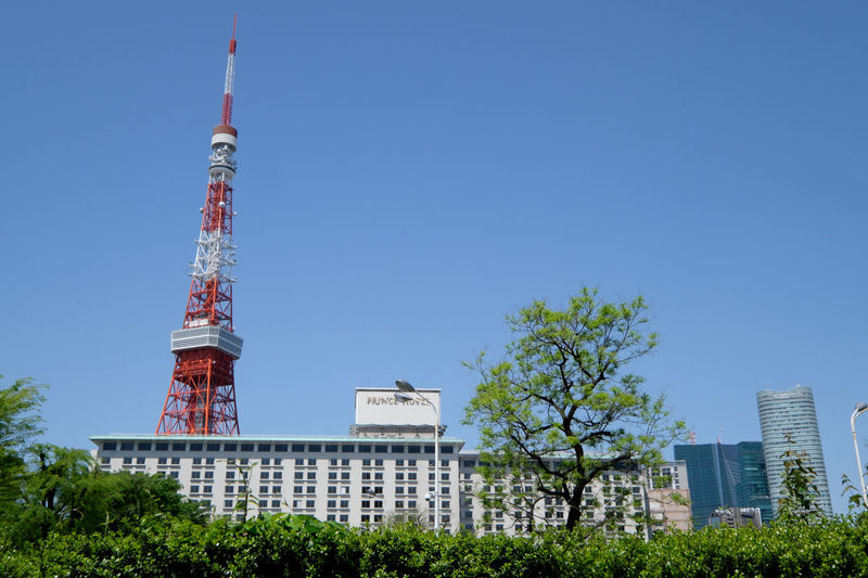 Low angle view of tokyo tower against clear sky in city