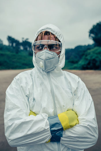 Scientist wearing protective workwear standing outdoors
