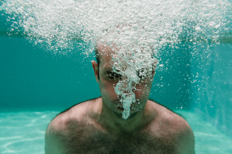 Portrait of man swimming in sea