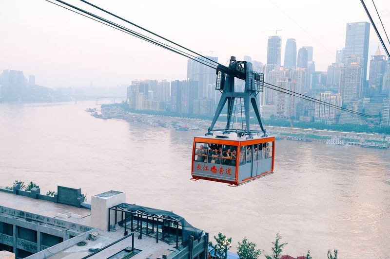 Overhead cable car over yangtze river in city