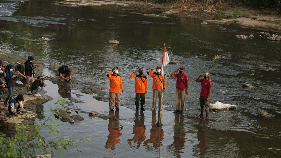 Group of people in river
