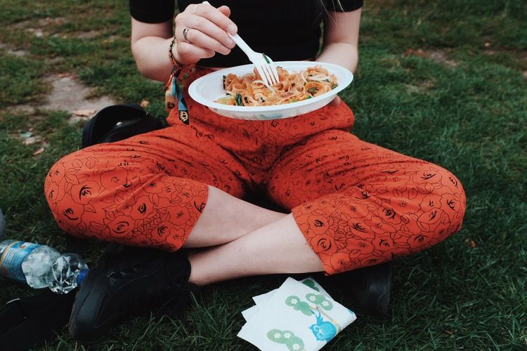 Woman eating outdoors
