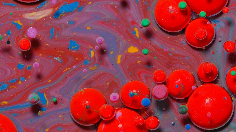 Full frame shot of multi colored candies in water