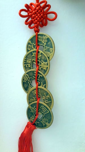 Close up of red bell against white background