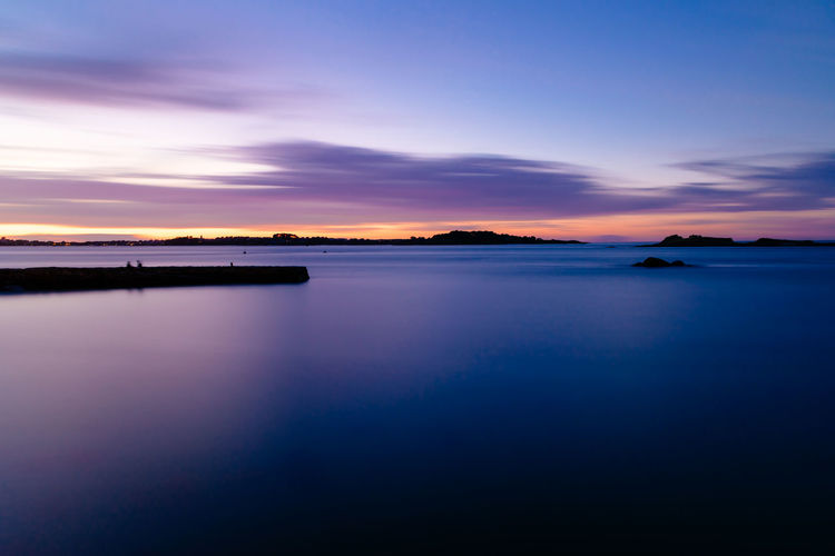 Island of batz and roscoff in brittany, france. view at sunset from pier