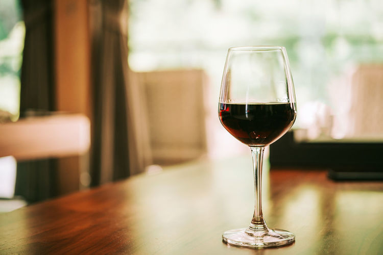 Close-up of wine in glass on table