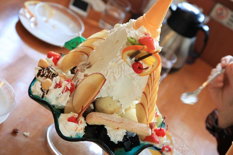 Close-up of huge parfait on table