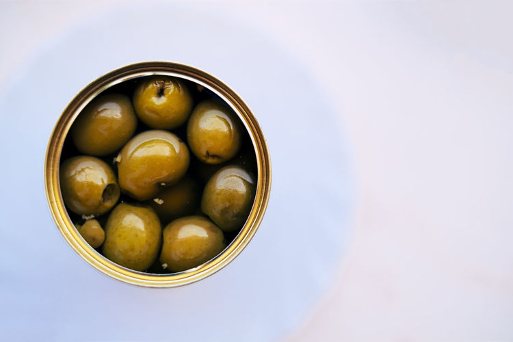 High angle view of olives in a can on table