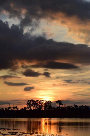 Scenic view of lake against romantic sky at sunset
