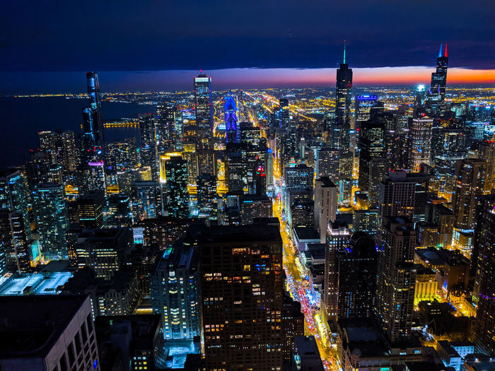 High angle view of illuminated buildings in chicago at night.