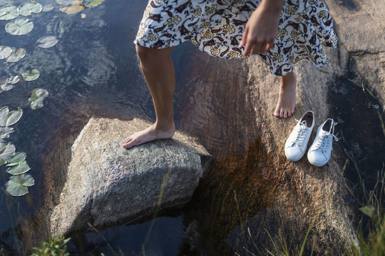 Womans feet on rocks