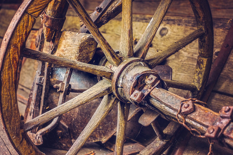 High angle view of rusty wheel on wood
