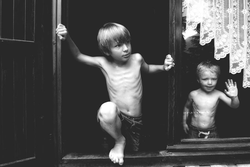 Portrait of boys in window