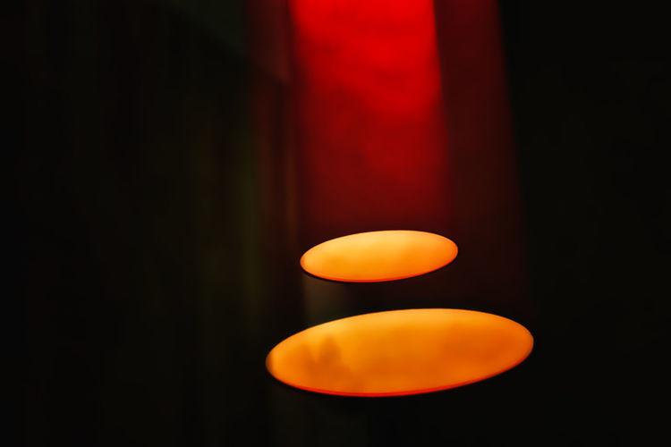 Black Background Circle Close-up Copy Space Dark Electricity Glowing Illuminated Indoors Light - Natural Phenomenon Lighting Equipment Night No People Orange Orange Color Red Single Object Still Life Studio Shot Yellow