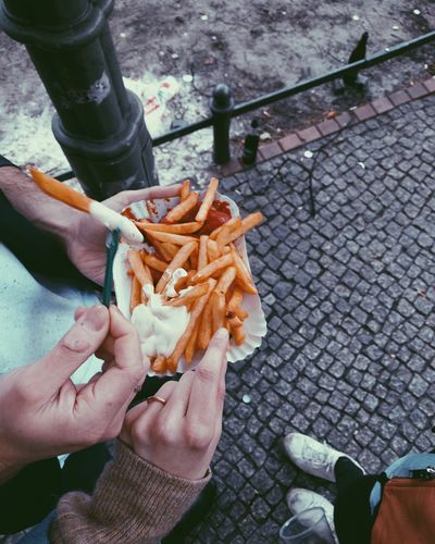 Low section of man eating food
