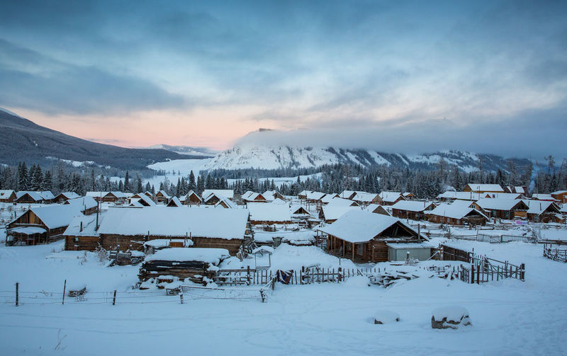 Scenic view of snow covered mountains against sky