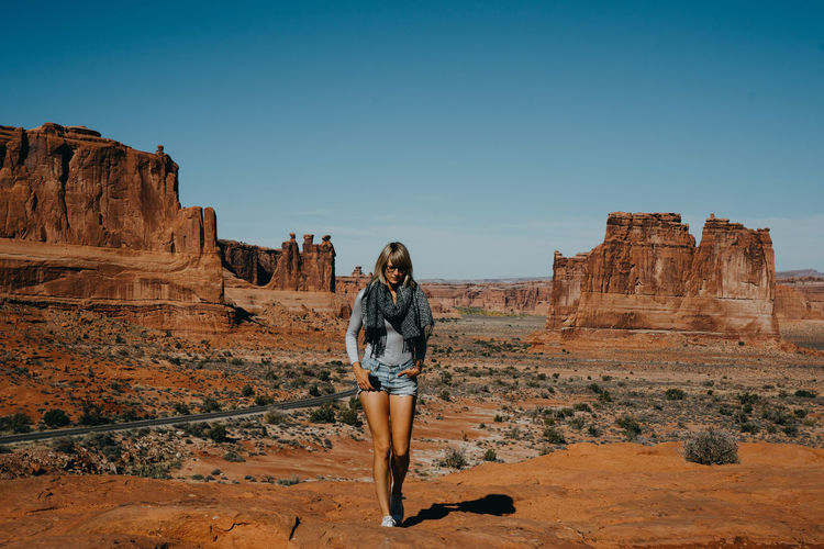 Full length of woman standing at monument valley