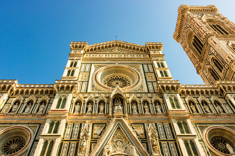 Low angle view of duomo santa maria del fiore against clear sky in city