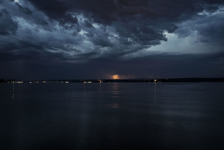 Scenic view of sea against sky at dusk