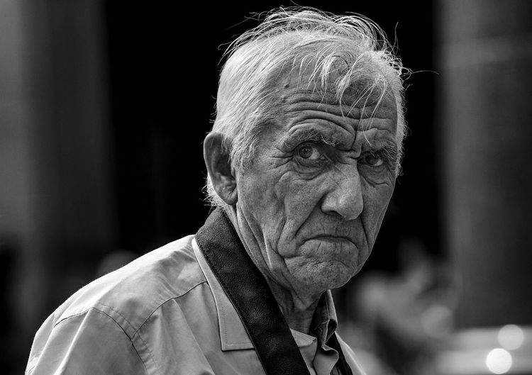 Close-up portrait of senior man outdoors