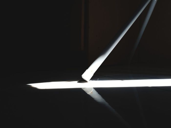 Directly below shot of illuminated lamp against black background