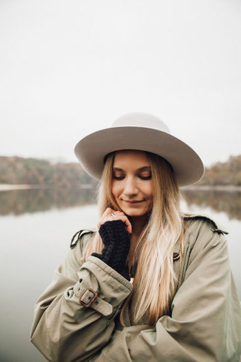 Portrait of beautiful young woman in hat