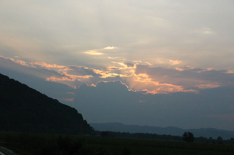 Scenic view of mountains against dramatic sky