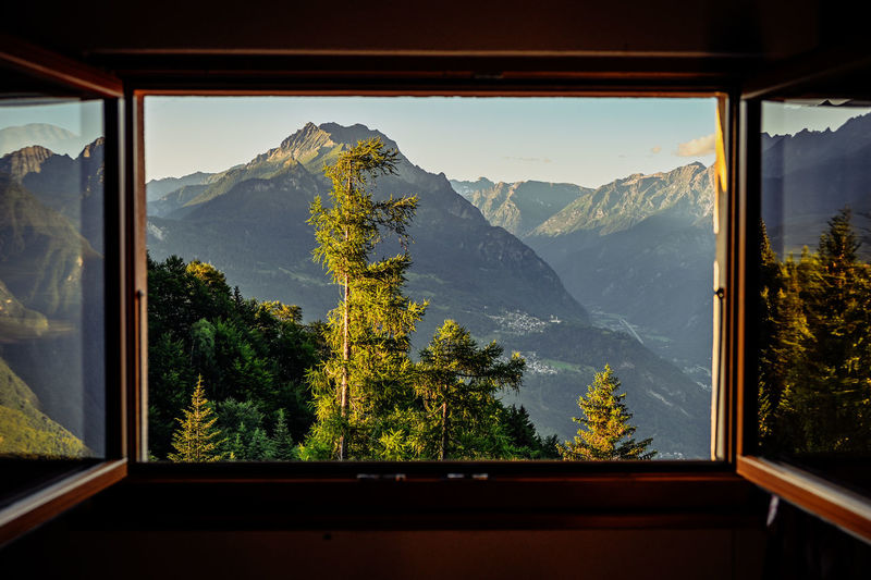 Beautifully window view on swiss alps 