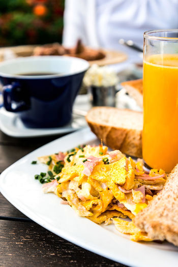 Scrambled eggs and orange juice for breakfast