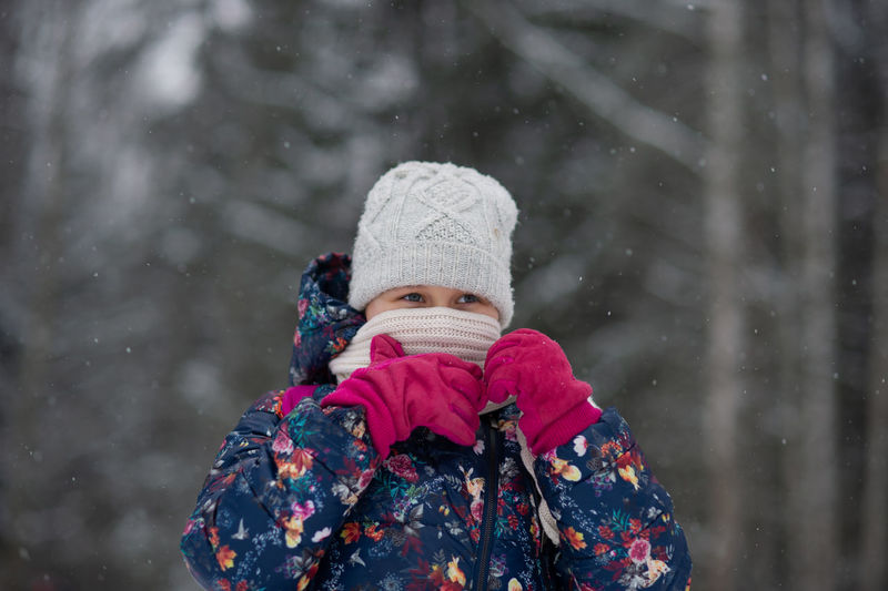 Portrait of girl wearing hat during winter