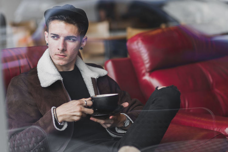 Man sitting in coffee shop dressed in casual street fashion Adult Arts Culture And Entertainment Brick Brick Wall Coffee Coffee Shop Drink Fashion Food And Drink Lifestyles Looking Men Mens Menswear One Man Only One Person Only Men People Real People Seat Sitting Street Street Fashion Street Photography Young Adult The Modern Professional